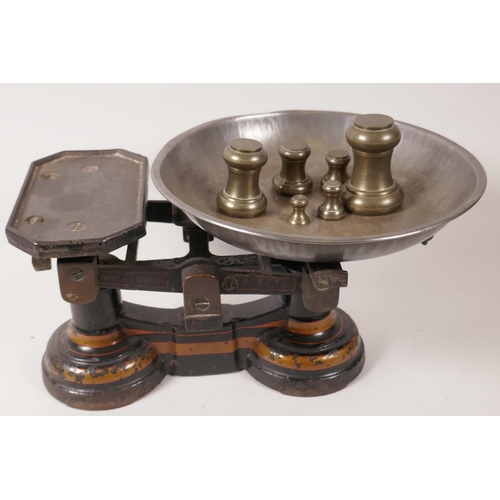 64 - A set of cast iron kitchen scales by Parnell and Sons Ltd, Bristol, together with a set of seven bra... 