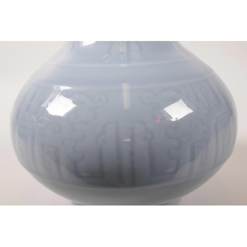 70 - A Chinese powder blue glazed porcelain vase with archaic style underglazed decoration, 11