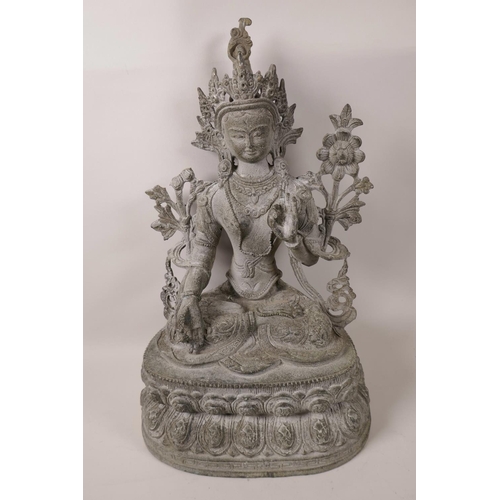 72 - A Tibetan bronze figurine of a female deity seated in meditation, 15