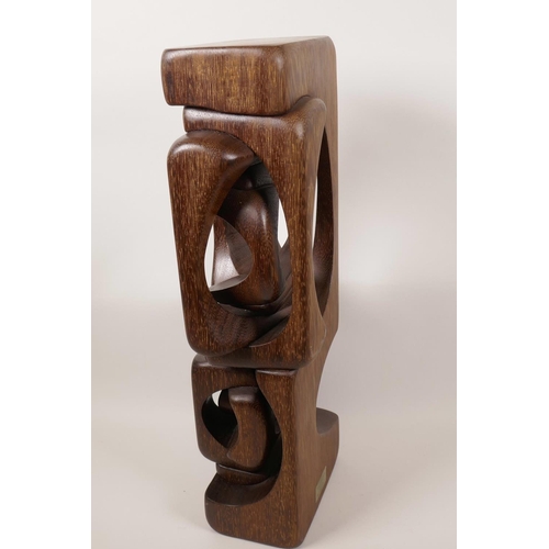 16 - A carved hardwood sculpture in the manner of Brian Wilsher, unsigned, 18