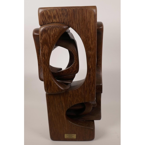 16 - A carved hardwood sculpture in the manner of Brian Wilsher, unsigned, 18