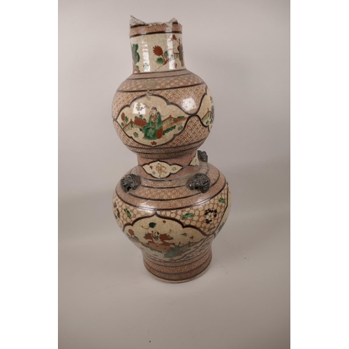 34 - A C19th Chinese double gourd shaped porcelain vase decorated with panels of figures in garden scenes... 