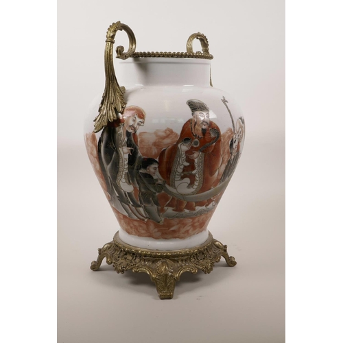 40 - A Chinese polychrome porcelain vase with ormolu mounts and base, the body decorated with depictions ... 