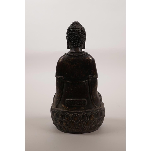 43 - A Sino-Tibetan coppered and gilt bronze of Buddha seated on a lotus throne, 6 character mark to the ... 