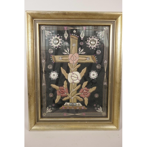 44 - A framed stumpwork and embroidered crucifix with sequined decoration, 15