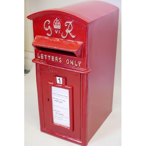 46 - A metal postbox with cast iron front, 23