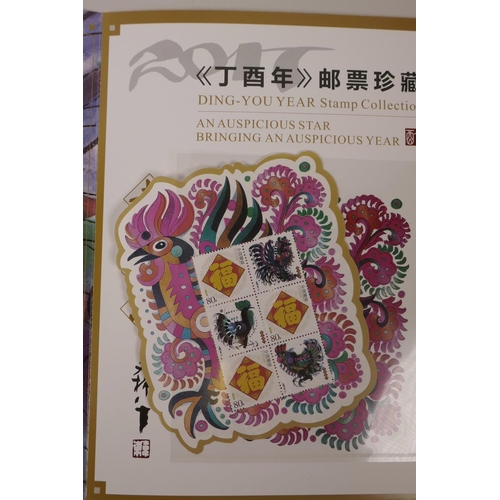 47 - A wallet of facsimile (replica) Chinese stamps commemorating the 2017 Year of the Rooster, 8½