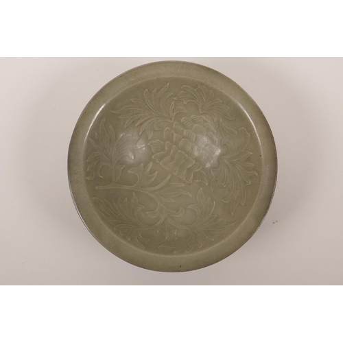 51 - A Chinese olive glazed Song style bowl with incised and reticulated floral decoration, 7