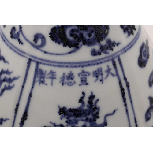 53 - A Chinese blue and white pottery pear shaped vase with decorative lobed panels depicting phoenix, 6 ... 