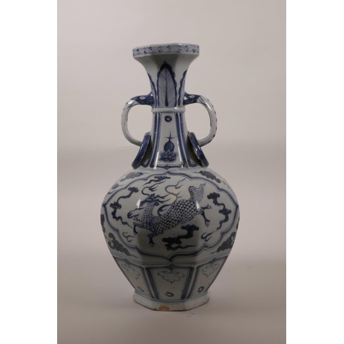 58 - A Chinese blue and white Ming style pottery vase with two loop handles and decorative panels depicti... 