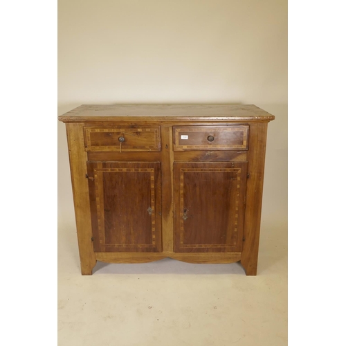 1132 - A late C18th French inlaid walnut buffet, with two drawers over two cupboards, raised on shaped supp... 