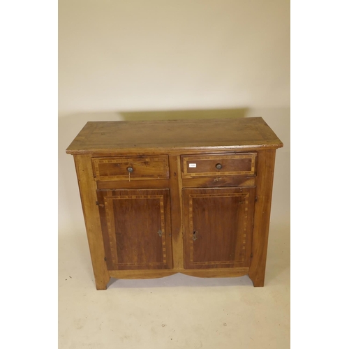 1132 - A late C18th French inlaid walnut buffet, with two drawers over two cupboards, raised on shaped supp... 