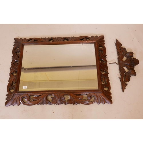 1134 - A C19th French carved oak cushion wall mirror, with original bevelled glass plate and carved lion cr... 