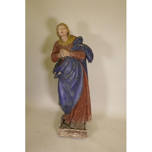 1138 - A C19th carved and gessoed pine figure of the Virgin Mary at prayer, 56