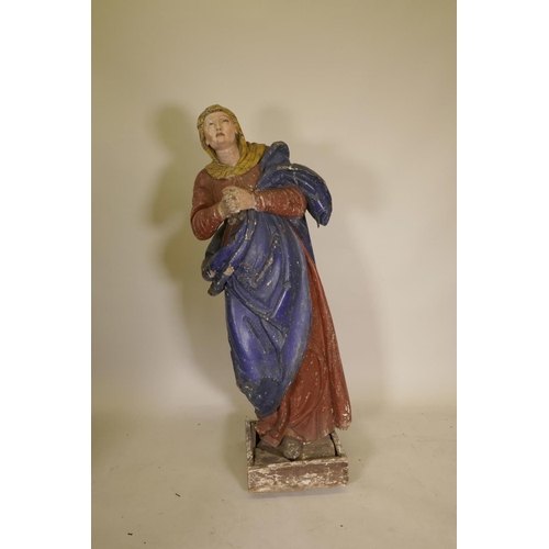 1138 - A C19th carved and gessoed pine figure of the Virgin Mary at prayer, 56