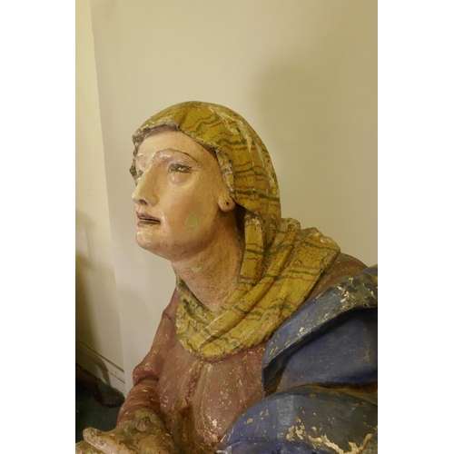 1138 - A C19th carved and gessoed pine figure of the Virgin Mary at prayer, 56