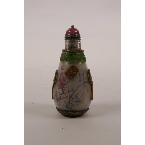 21 - A Chinese reverse painted glass snuff bottle decorated with bamboo, trees in blossom and flowers, 3