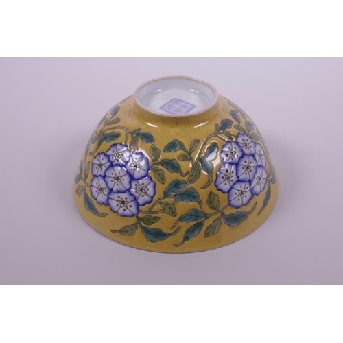 25 - A Chinese yellow ground porcelain rice bowl with polychrome enamelled floral decoration, 4 character... 