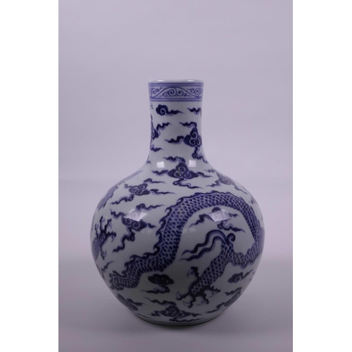 28 - A Chinese blue and white porcelain vase decorated with a dragon in flight, 6 character mark to rim, ... 