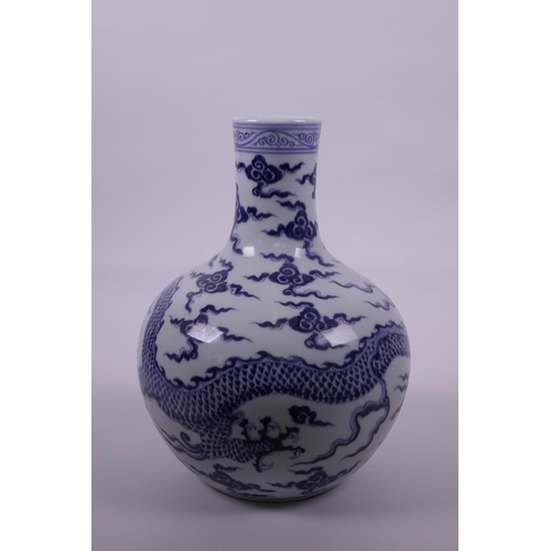 28 - A Chinese blue and white porcelain vase decorated with a dragon in flight, 6 character mark to rim, ... 