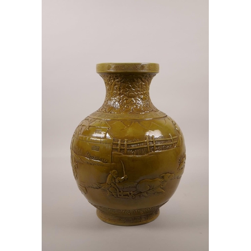 50 - A large Chinese ochre glazed pottery vase with raised decoration of everyday village life, impressed... 