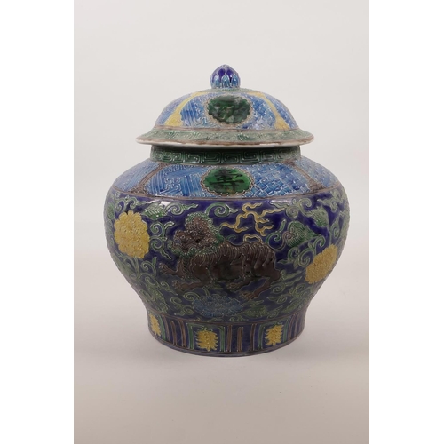 60 - A large Chinese polychrome porcelain jar and cover of baluster form with raised and enamelled kylin ... 