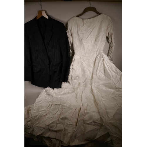 66 - A white satin wedding dress from Marshall and Snelgrove, and a Christian Dior blue pin striped suit