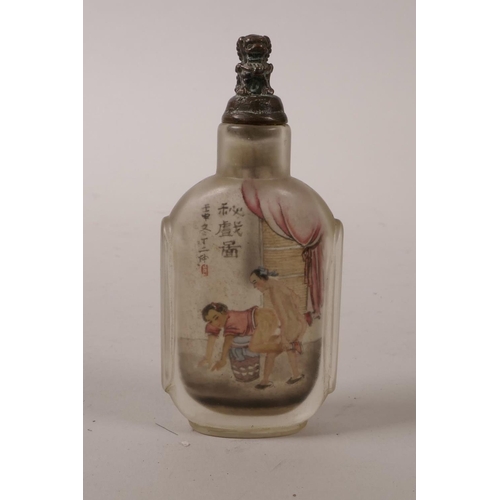 15 - A Chinese reverse painted glass snuff bottle with erotic scene, character inscription verso, 3½