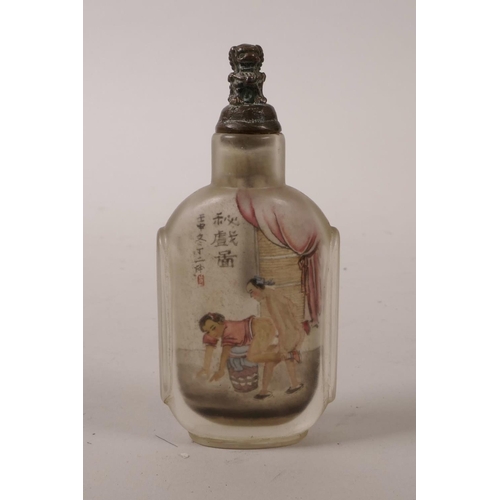 15 - A Chinese reverse painted glass snuff bottle with erotic scene, character inscription verso, 3½