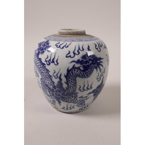 28 - A C19th blue and white ginger jar decorated with a dragon chasing the flaming pearl, 5½