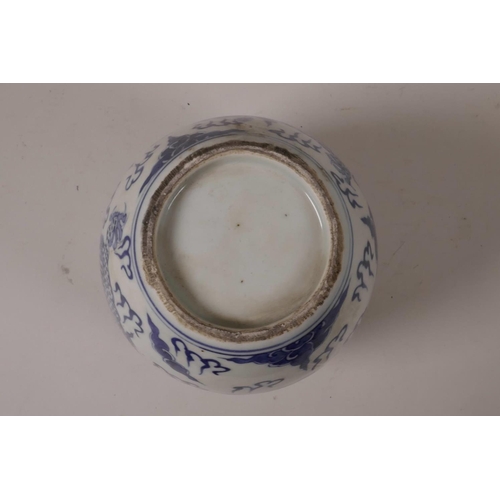 28 - A C19th blue and white ginger jar decorated with a dragon chasing the flaming pearl, 5½