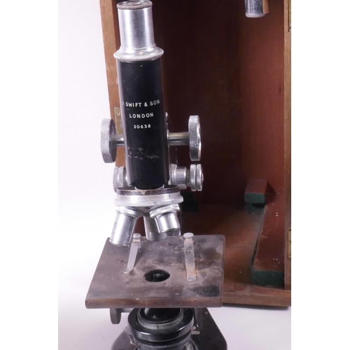 59 - A J Swift and Sons microscope no. 20638, in mahogany case with a few slides, together with a W Watso... 