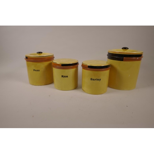 6 - Four Carlton Ware Art Deco yellow glazed dry storage jars, largest 7