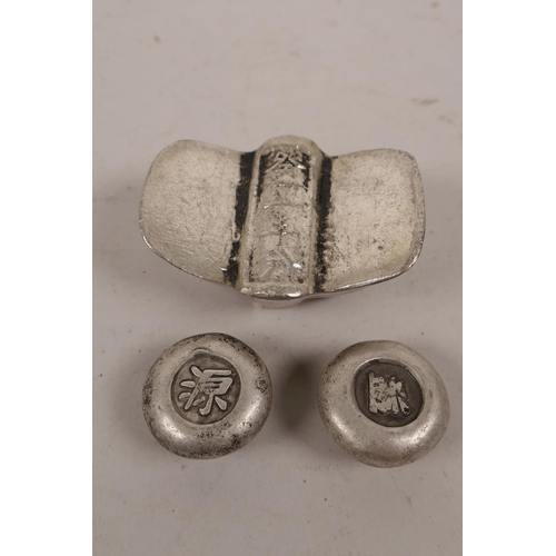 84 - A pair of small Chinese white metal trade tokens, and another larger, largest 2½