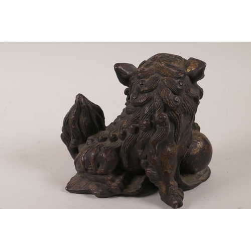 86 - A Chinese cast iron figurine of a fo dog, 5½