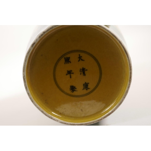 25 - A Chinese yellow ground porcelain vase decorated with green dragons chasing the flaming pearl, 6 cha... 