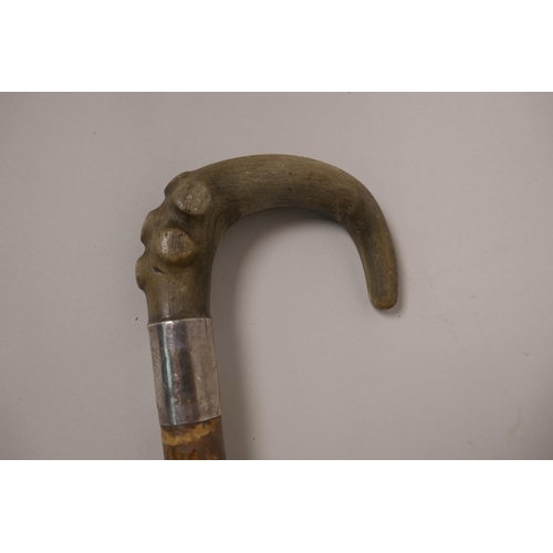 28 - A horn handled hiking stick with applied Scottish badges, 36