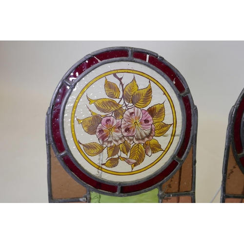 39 - Two stained glass windows, with painted floral decoration, 17½