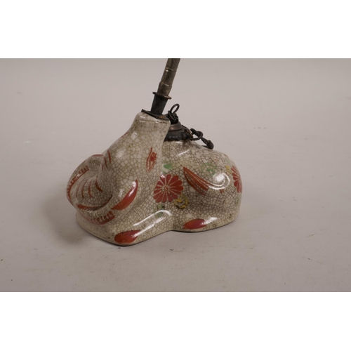 4 - A Chinese polychrome enamelled crackleware waterpipe in the form of a buffalo, 10½