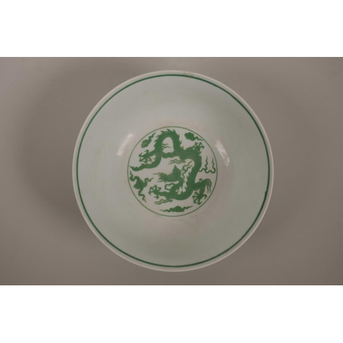 45 - A Chinese porcelain bowl decorated with green enamelled dragons in flight, 6 character mark to base,... 