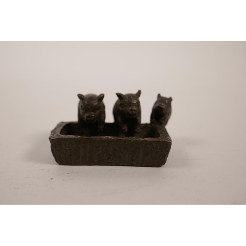 5 - A small Chinese bronze of three piglets eating from a trough, 2