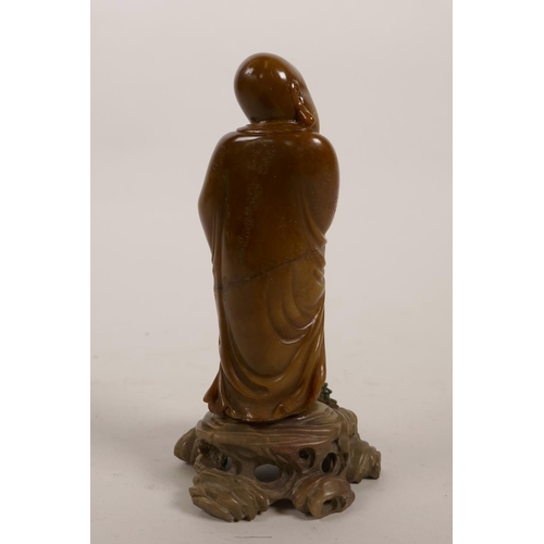 51 - A Chinese carved soapstone lohan and stand, 5