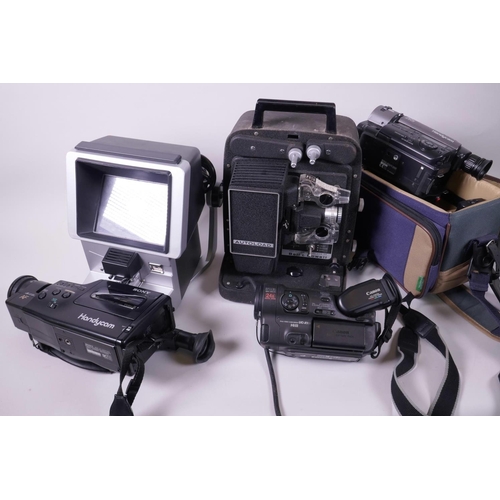 47 - Two Sony Handycam 8mm video recorders, together with a Canon UC-XI Hi8 camcorder, a Bell and Howell ... 