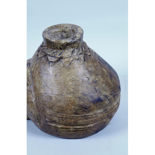 17 - An ethnic carved wood jar/pourer, 10½