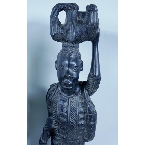 23 - Two African carved ebony figures, largest 17½