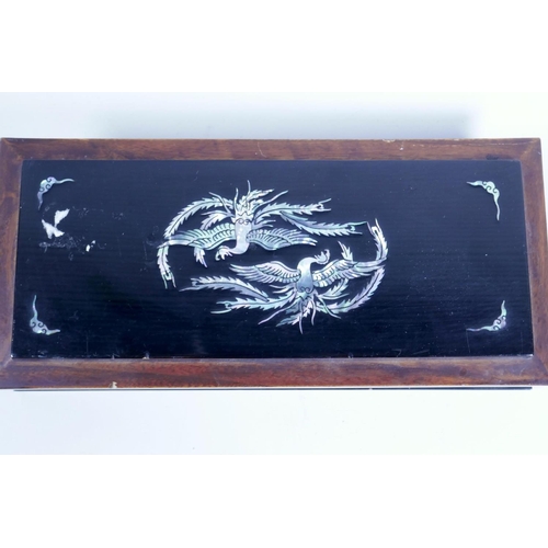 27 - A Japanese lacquered wood glove box, the cover with phoenix and bats, and mother of pearl, 10½