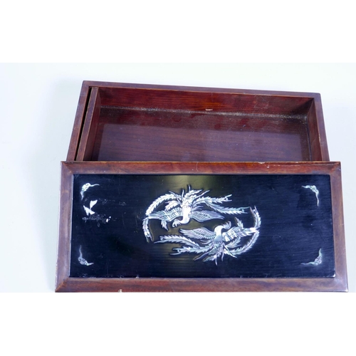 27 - A Japanese lacquered wood glove box, the cover with phoenix and bats, and mother of pearl, 10½