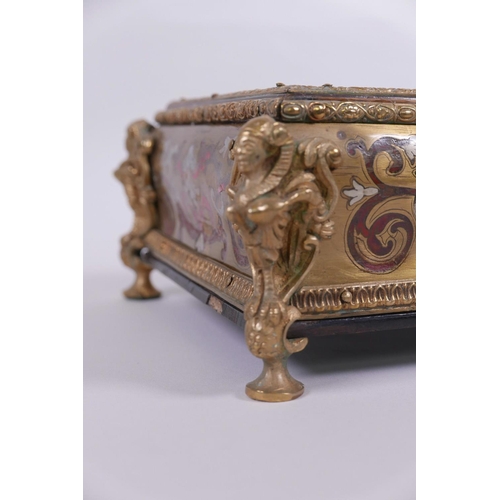 30 - A French boullework and ormolu desk stand, with two inkwell compartments and pen tray, raised on win... 