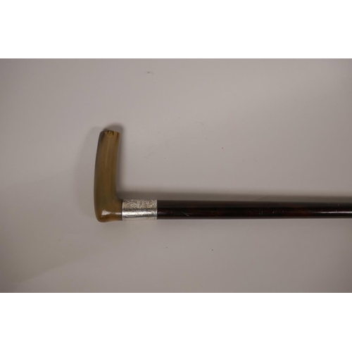 39 - A horn handled mahogany walking stick with engraved white metal collar, 35