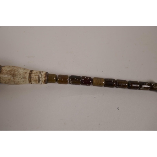 46 - A Chinese agate and bone handled calligraphy brush, 10